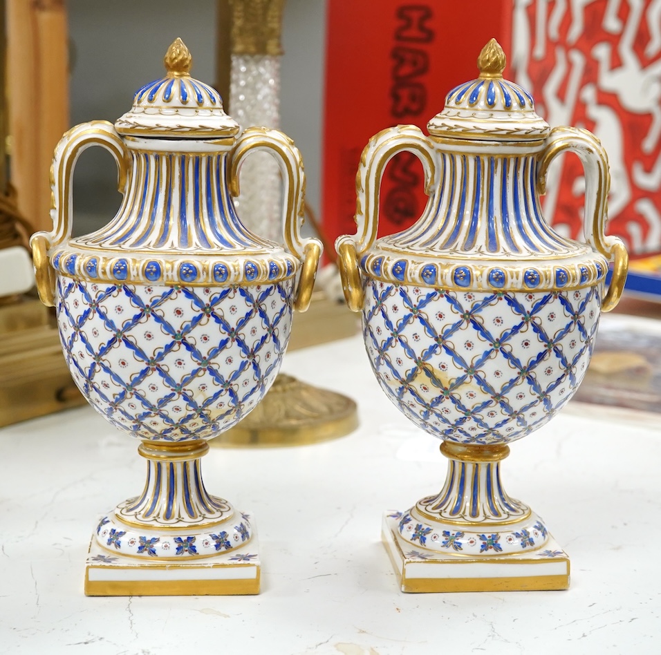 A pair of early 20th century Sevres style vases and covers, 21cm. Condition - good